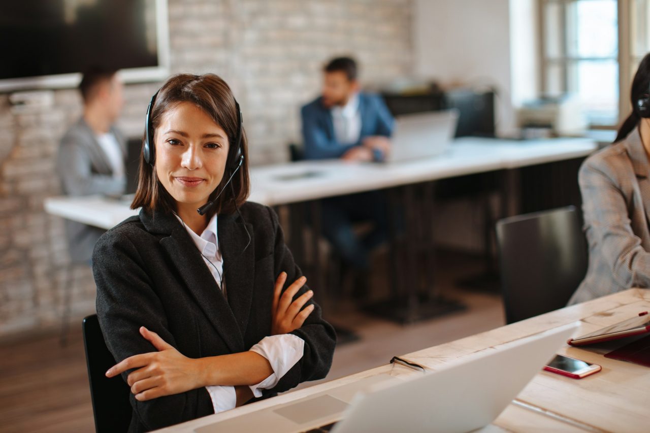 young woman customer support posing in the office